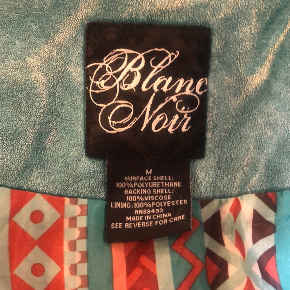 Worn once. Blanc Noir Jacket. Pattered Teal color, Size M. Excellent condition.